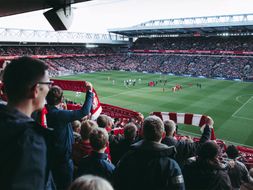 Fans cheering at Anfield