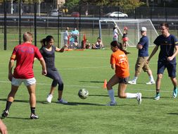 Photo of students playing soccer.