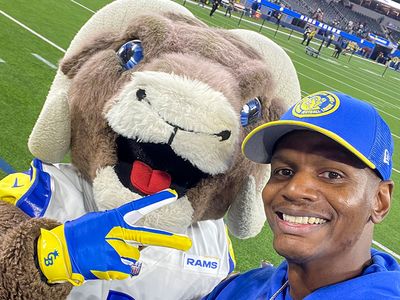 William Jones posing with Rampage the St Louis Rams mascot