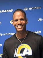 Portrait of William in front of a microphone during a press conference for the rams