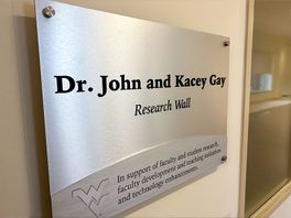 Dr. John and Kacey Gay plack in the CAHS lobby