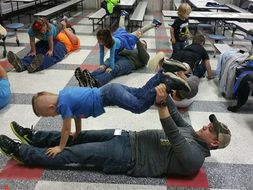 fathers doing yoga with their kids