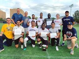 Faculty and students from the winning team pose after the diversity cup