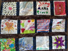 Photo of a diversity quilt that has personalized squares from individuals.