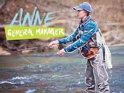 Anne, the General Manager, is fly fishing.