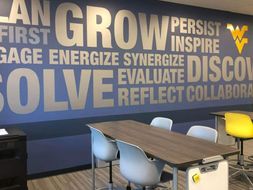 An inspiring mural that urges students to grow and persist located in the back of the ALC