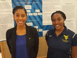 Students presenting their poster during student research day